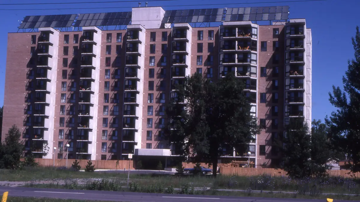 Apartment building exterior suitable for a shared solar installation
